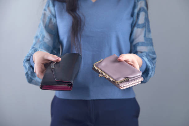 istock woman hand holding wallet 1219748121