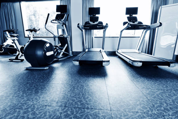 istock Group of exercise machines in gym room 1219748133