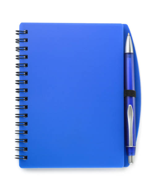 istock Top view of blue notebook and pen 1219748220