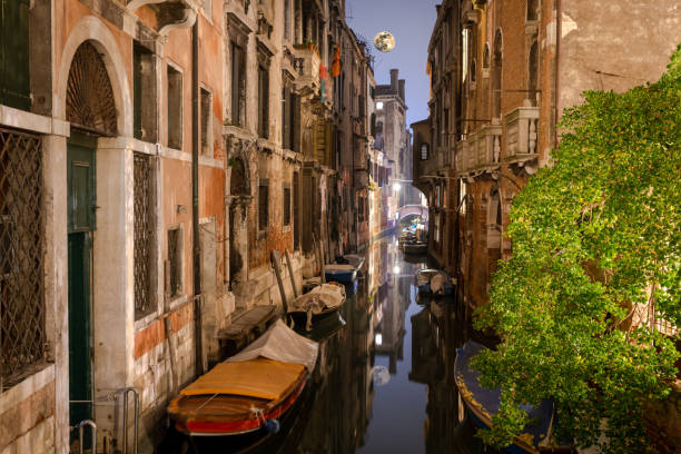 moon reflection on  a beautiful water canal in Venice