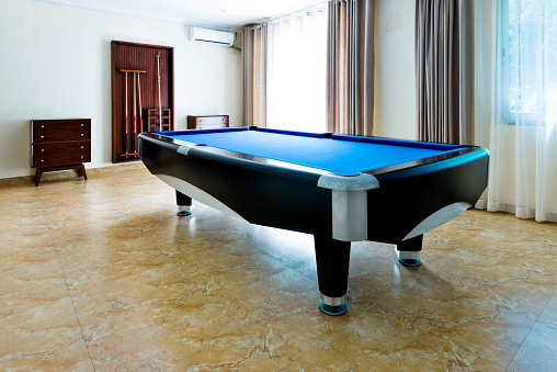 Pool ball table in games room.