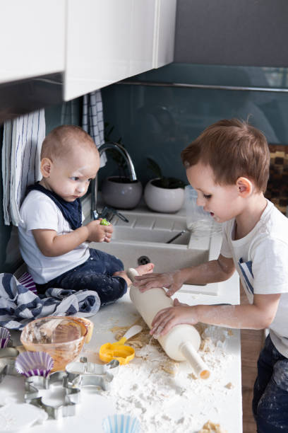istock Boys cooking  cookies 1219749348