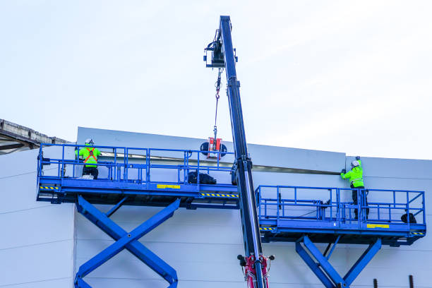 sandwich panels wall mounting using crane and scissor lifts steel sandwich panels wall mounting using crane and scissor lifts sandwich panel photos stock pictures, royalty-free photos & images