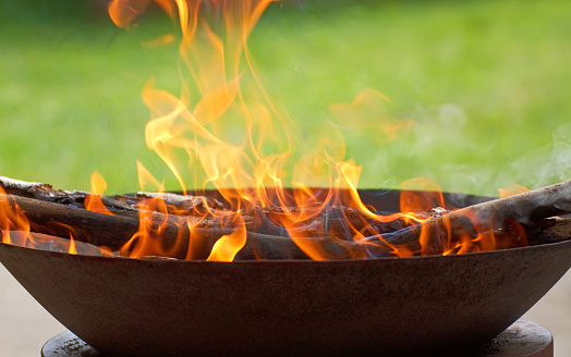 April 2020: Blazing flames in a fire bowl on a garden terrace