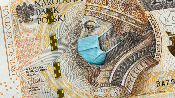 Coronavirus in Poland. Quarantine and global recession. 200 Polish zloty banknote Coronavirus in Poland. Quarantine and global recession. 200 Polish zloty banknote with face mask against infection. Global economy hit by covid19.National Bank of Poland prints money to save bugdet polish zloty photos stock pictures, royalty-free photos & images