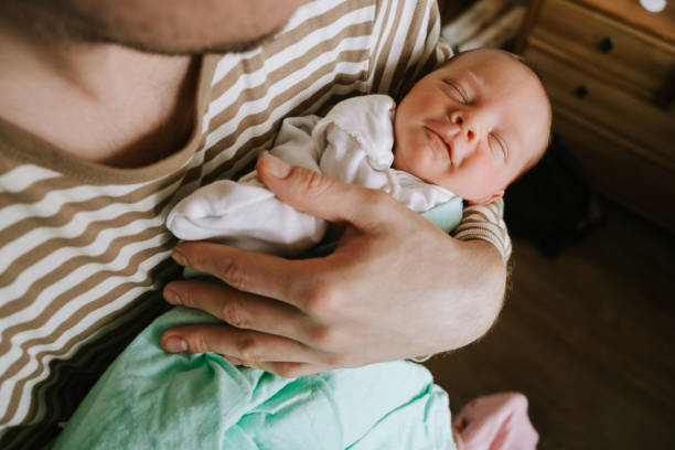 istock Father hugging his adorable newborn son. 1219752324