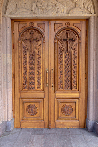 warm wooden door with crosses