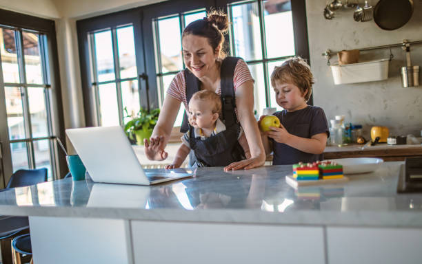 istock Mother trying to work from home 1219756529