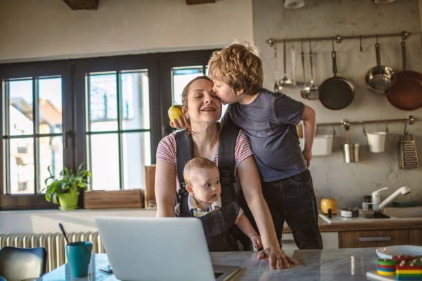 istock Mother trying to work from home 1219756594