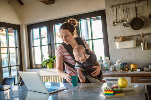 istock Mother with baby work from home 1219757886