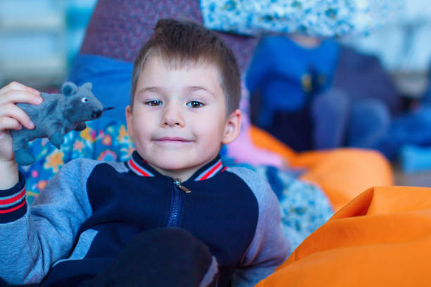 istock Child with a toy mouse, close-up 1219758381
