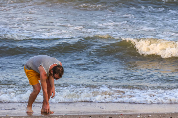 istock a young man filled up to lift a beautiful shell 1219758791