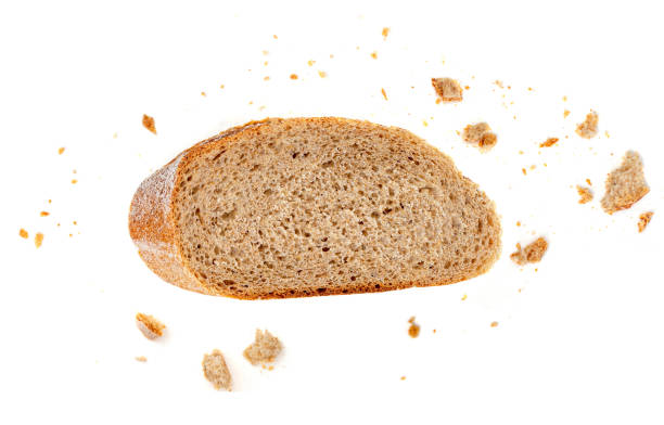 istock Bread slice and crumbs isolated on white background. Top view