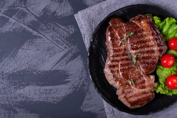istock Grilled beef steak served on the stone plate 1219760580