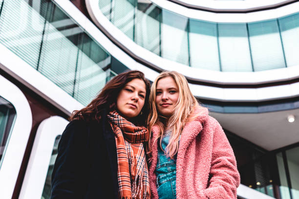 istock Doubtful Looking Young Women Together 1219763498