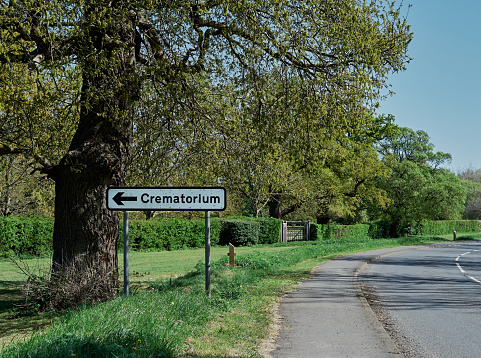 Crematorium road sign on the road. Sping time
