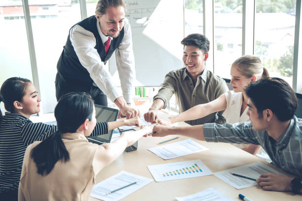 istock Success of group business people with join hands of teamwork. 1219764537