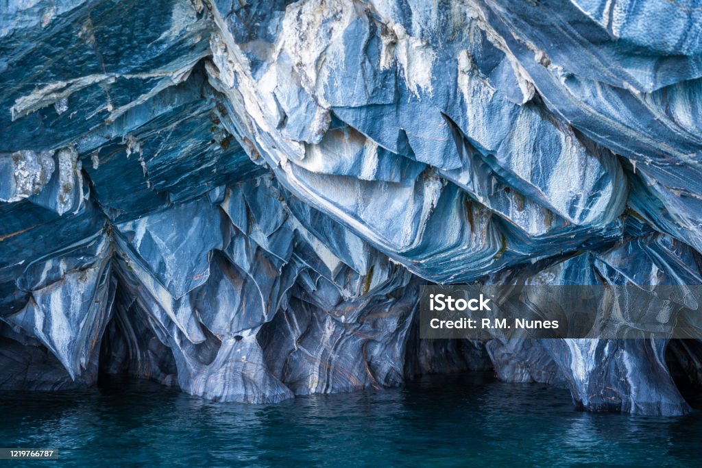 Marble Caves in General Carrera Lake, Patagonia, Chile The Marble Caves (Spanish: Cuevas de Marmol ), a series of sculpted caves in the General Carrera Lake in Chile, Patagonia, South America. Adventure Stock Photo