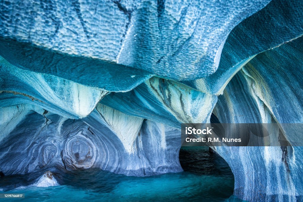 Natural Landmark Marble Caves in General Carrera Lake, Patagonia, Chile, South America The Marble Caves (Spanish: Cuevas de Marmol ) are a series of sculpted caves in the General Carrera Lake on the border of Chile and Argentina, Patagonia, South America. Adventure Stock Photo