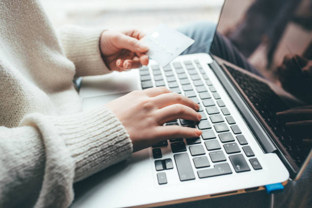 istock A young woman makes an online payment for a purchase. 1219768200