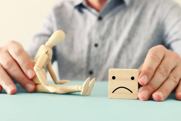 istock concept image of wooden dummy with worried stressed thoughts. depression, obsessive compulsive, adhd, anxiety disorders concept 1219768236