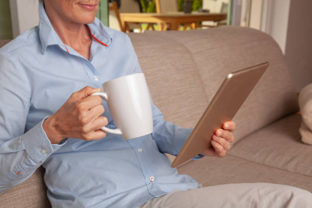 istock Mock up of a man holding a tablet. 1219771046