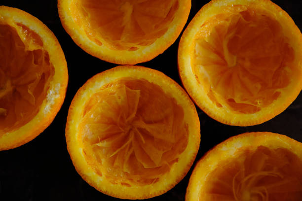 Orange Juice, Vitamin C Boost, Freshly hand juiced fruit juice. Half cut oranges. Healthy lifestyle