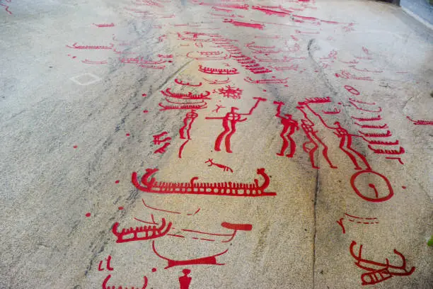 Rock Carvings from Bronze Age, which are about 3000 years old, located at one time on the shores of the fjord, now a UNESCO World Heritage Site. Some have been painted red for tourists. Tanum, Sweden.