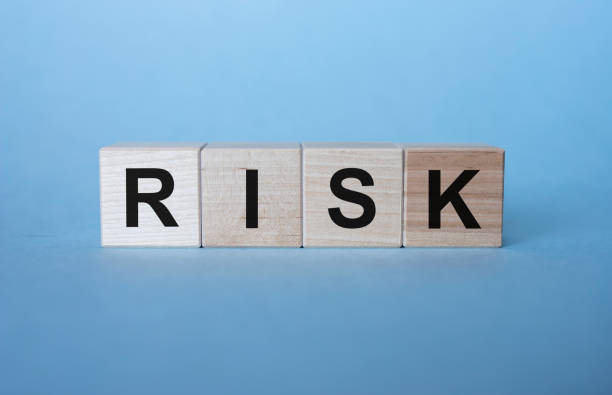istock inscription risk on wooden cubes on a gray-blue background 1219774112