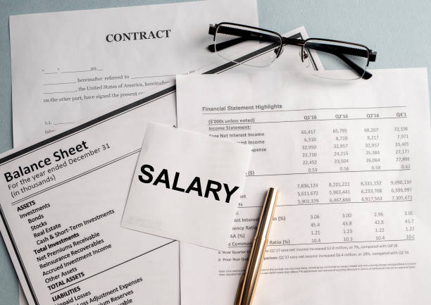 istock SALARY word on a white sticker and glasses and pen on documents 1219774134