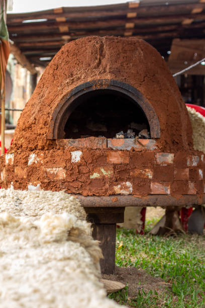 Traditional building for cooking Barbecue grill made of closed oval shaped clay. Traditional building for cooking food or barbecue. adobe oven stock pictures, royalty-free photos & images