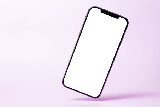 Smartphone mock up, phone with blank screen and shadow isolated on purple background. Modern technologies social networks and applications. Symbol of lightness freshness airiness. Copy space stock photo