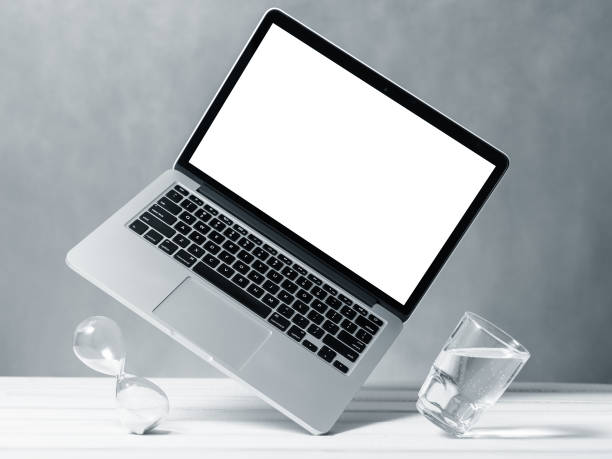 istock Laptop mockup, computer with blank screen flying under the table. Symbol of lightness freshness airiness. Modern technologies social networks and applications. Copy space 1219775969