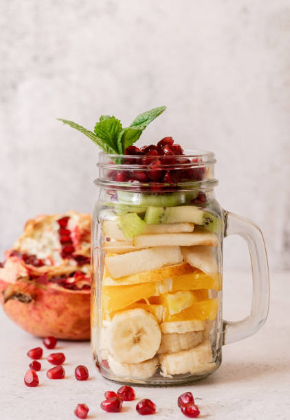 istock fruit salad in a mason jar on rustic concrete background front view 1219776806