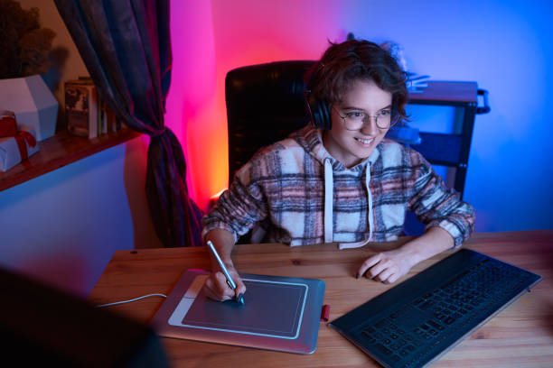 istock Digital desinger using graphic tablet and stylus. Freelancer desinger working from home 1219777051