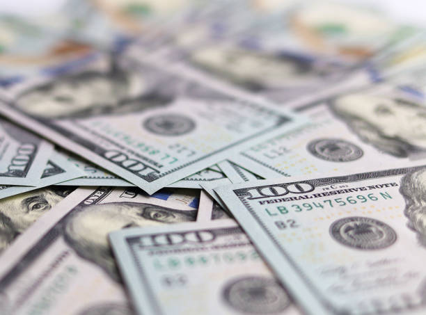 istock a bunch of dollar bills close up 1219779502