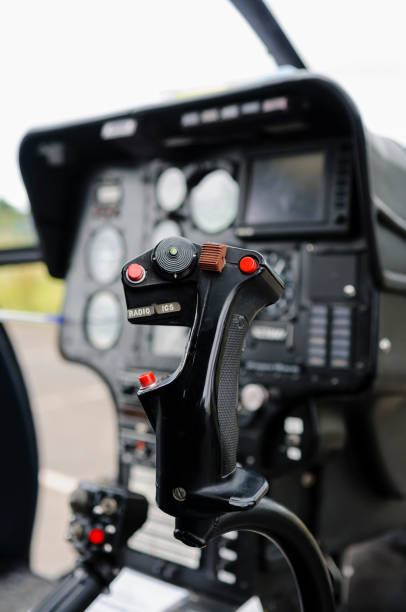 istock Cyclic stick in the cockpit of a helicopter 1219780077