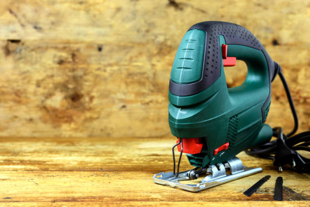 istock Electric jig saw on wooden table 1219780323