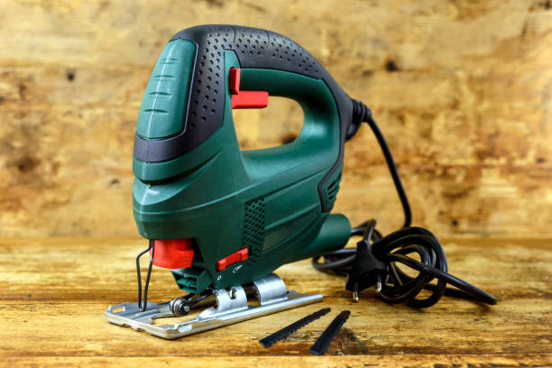 istock Electric jig saw on wooden table 1219780340