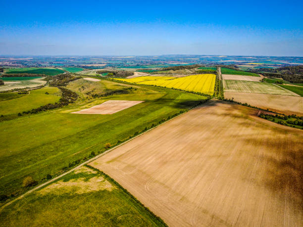 The Ridgeway view at Blewbury near Lowbury Hill The Ridgeway at Blewbury on the Oxfordshire/Berkshire border on a sunny April day in 2020 during the covid 19 lockdown. No people, no vapour trails just brilliant colours from the air with a drone ridgeway stock pictures, royalty-free photos & images