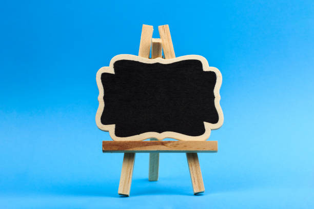 istock decorative easel on a blue background, place for text or advertisement 1219780480