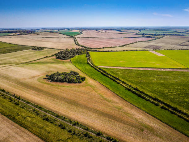 The Ridgeway view at Blewbury near Lowbury Hill The Ridgeway at Blewbury on the Oxfordshire/Berkshire border on a sunny April day in 2020 during the covid 19 lockdown. No people, no vapour trails just brilliant colours from the air with a drone ridgeway stock pictures, royalty-free photos & images