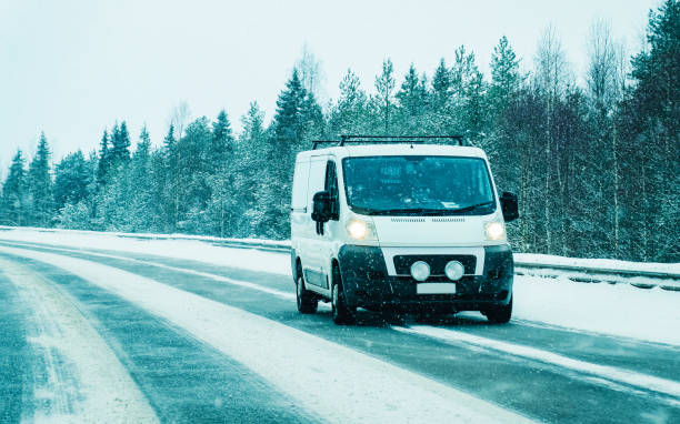istock Mini van at Snowy Winter Road in Finland Lapland 1219781909