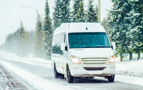 istock Minivan and cars in road in winter Rovaniemi 1219782003