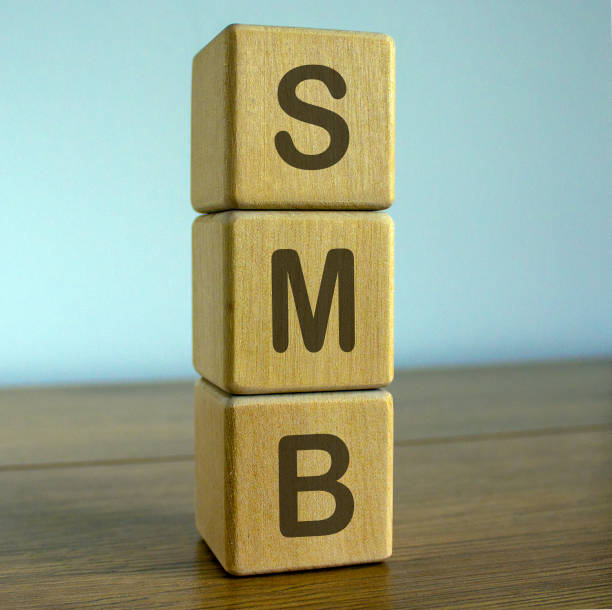 istock Concept word SMB on cubes on a beautiful wooden table. 1219783921