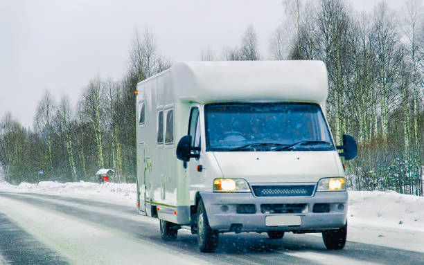 istock Caravan on road in winter Rovaniemi 1219786204
