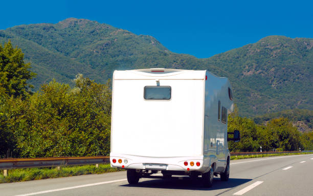istock White Caravan on road in Switzerland 1219786322