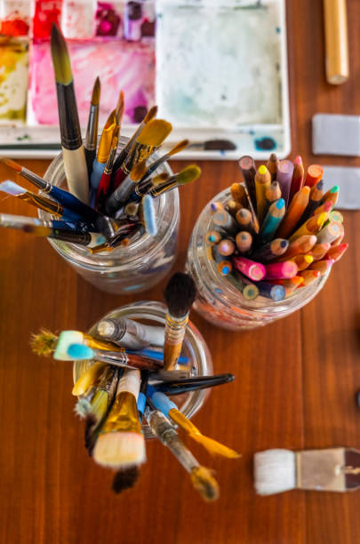 istock Art Supplies And Paintings On A Kitchen Table 1219786438