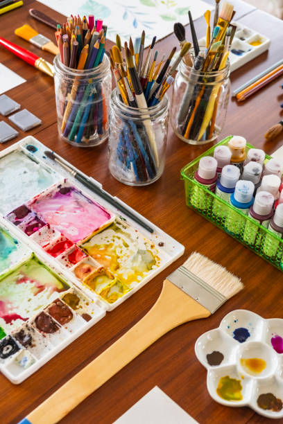 istock Art Supplies And Paintings On A Kitchen Table 1219786534