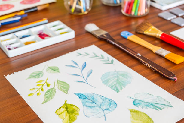 istock Art Supplies And Paintings On A Kitchen Table 1219786889